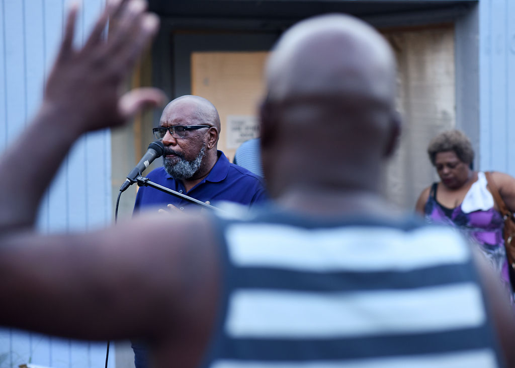 Ward 1 Councilman Clyde Ruffin leads a prayer at the Peace in the Streets Prayer and Fellowship Vigil